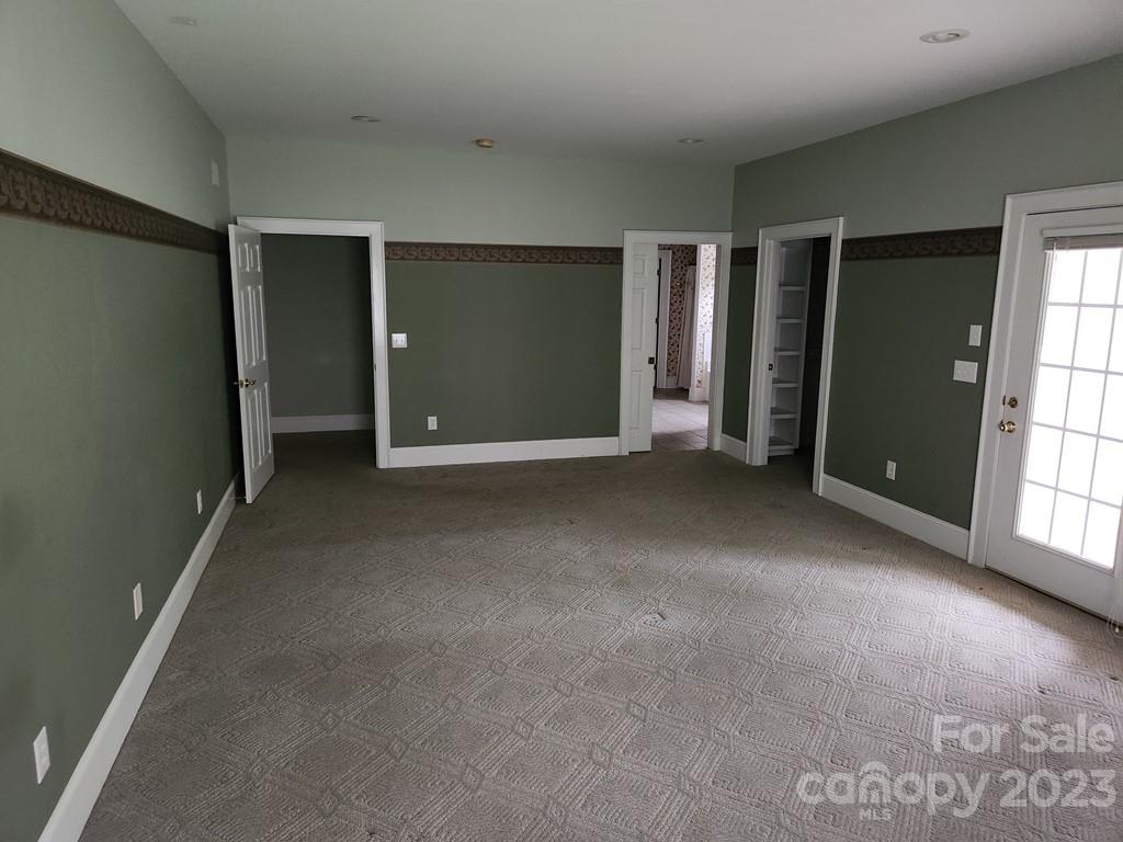 360 Hooper Creek Road Tryon, NC 28782 - Photo 24 of 38 a view of a livingroom with an empty space and a window
