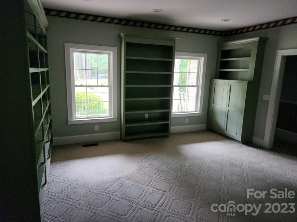360 Hooper Creek Road Tryon, NC 28782 - Photo 27 of 38 an empty room with windows and closet