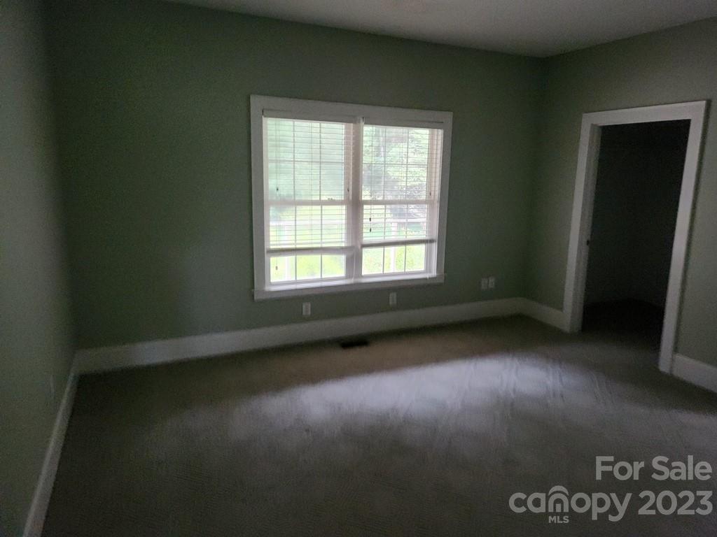 360 Hooper Creek Road Tryon, NC 28782 - Photo 33 of 38 an empty room with a window