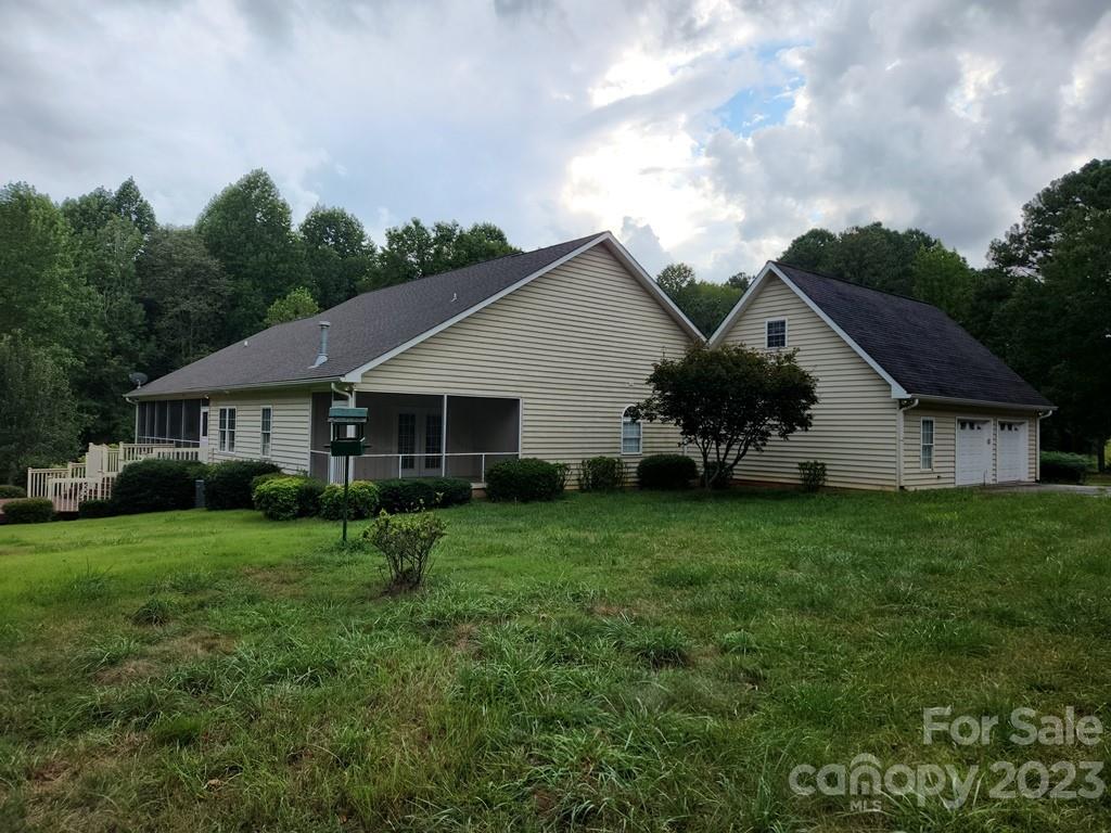 360 Hooper Creek Road Tryon, NC 28782 - Photo 4 of 38 a front view of a house with garden