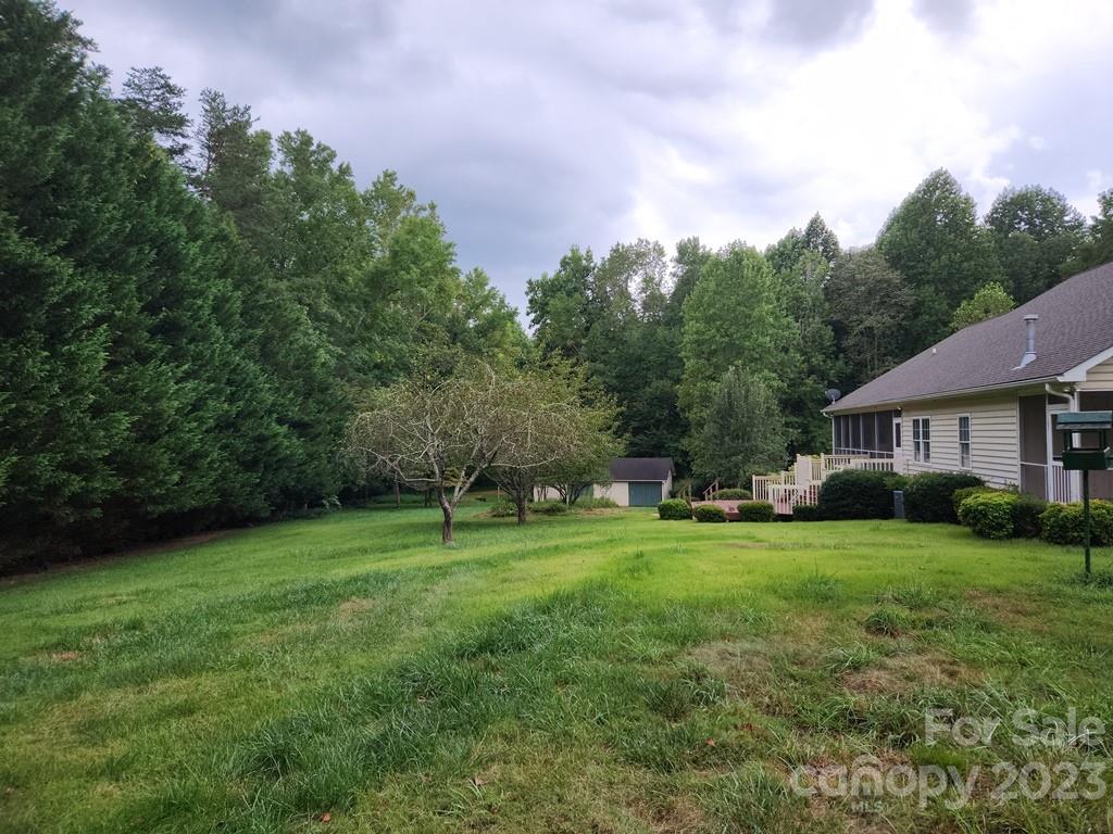 360 Hooper Creek Road Tryon, NC 28782 - Photo 5 of 38 a view of a house with a big yard and large trees