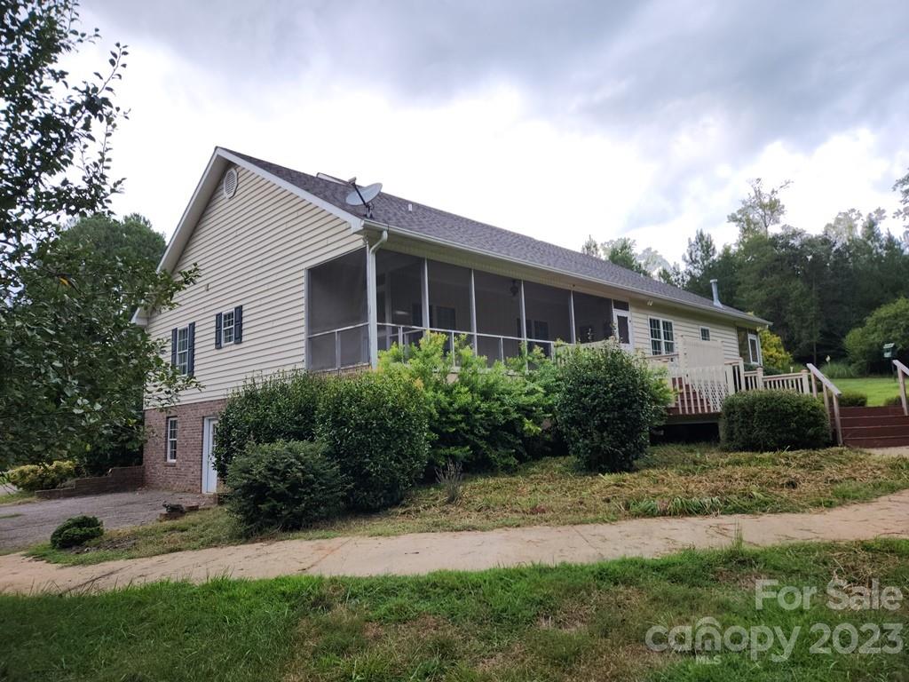 360 Hooper Creek Road Tryon, NC 28782 - Photo 6 of 38 a view of house with yard and green space