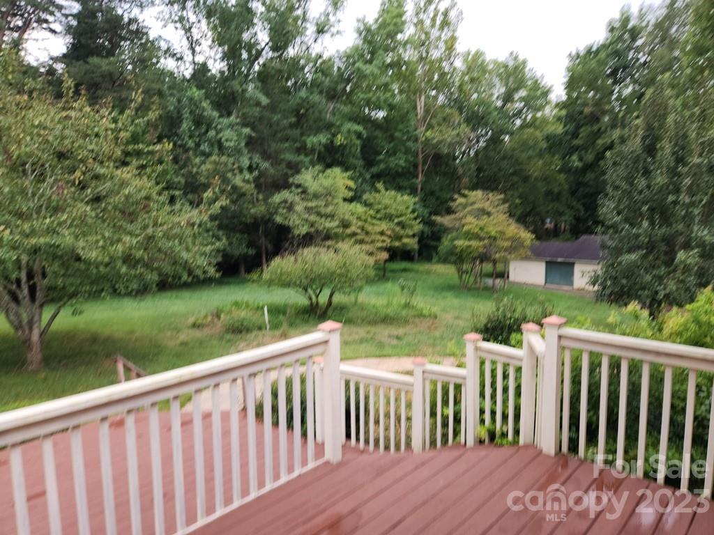 360 Hooper Creek Road Tryon, NC 28782 - Photo 8 of 38 a view of a wooden deck and a yard with swimming pool