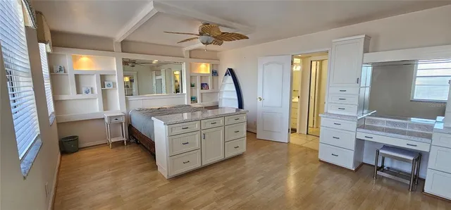 a view of a chairs and table in a balcony