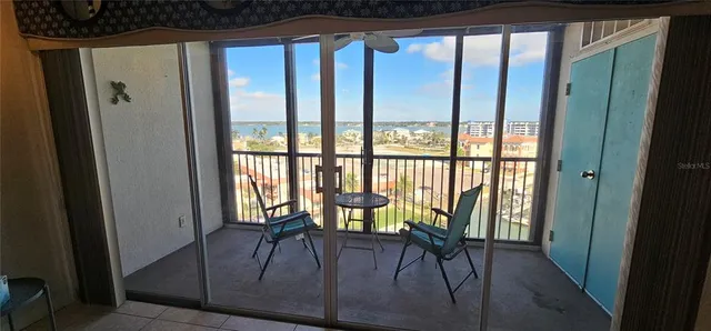 an aerial view of multiple house with outdoor space and lake view