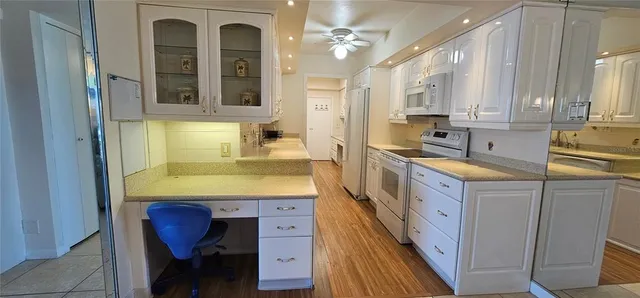 a bathroom with a sink a bathtub and a window