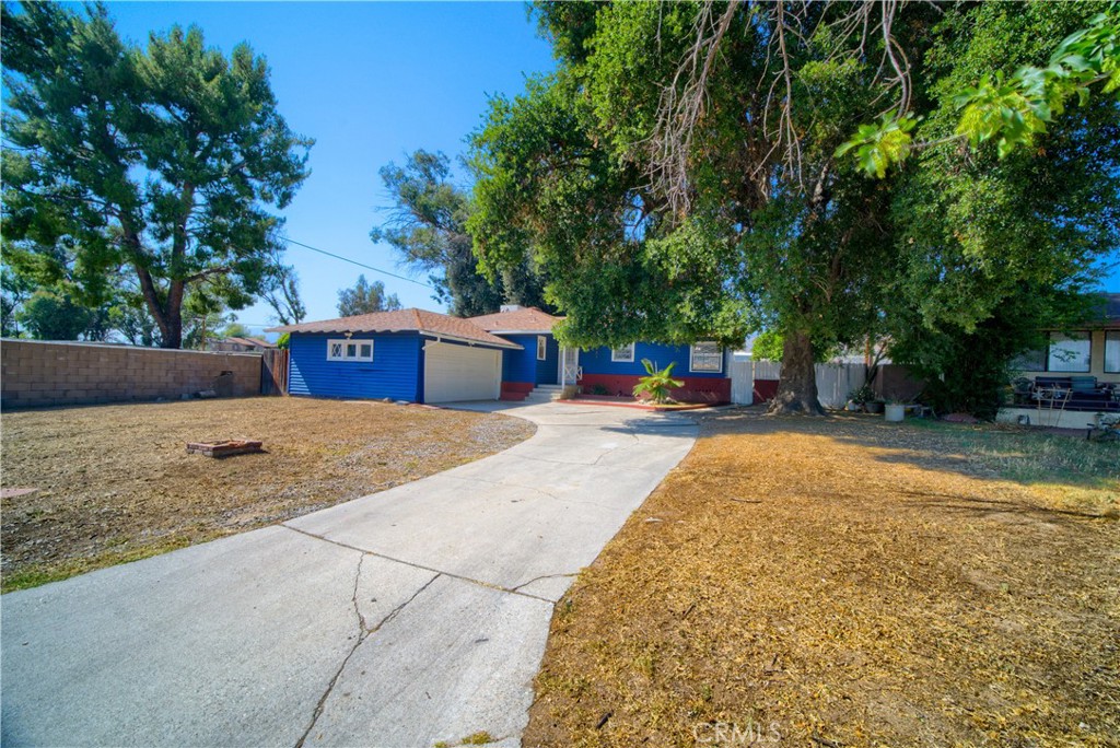 6083 Merito Avenue San Bernardino, CA 92404 - Photo 2 of 17 a view of a backyard with a fountain plants