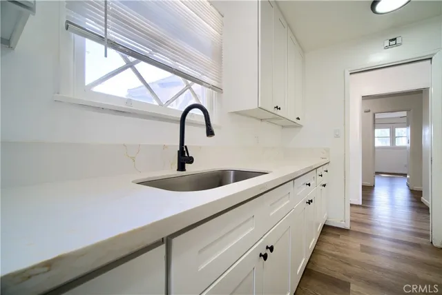 a kitchen with sink and window