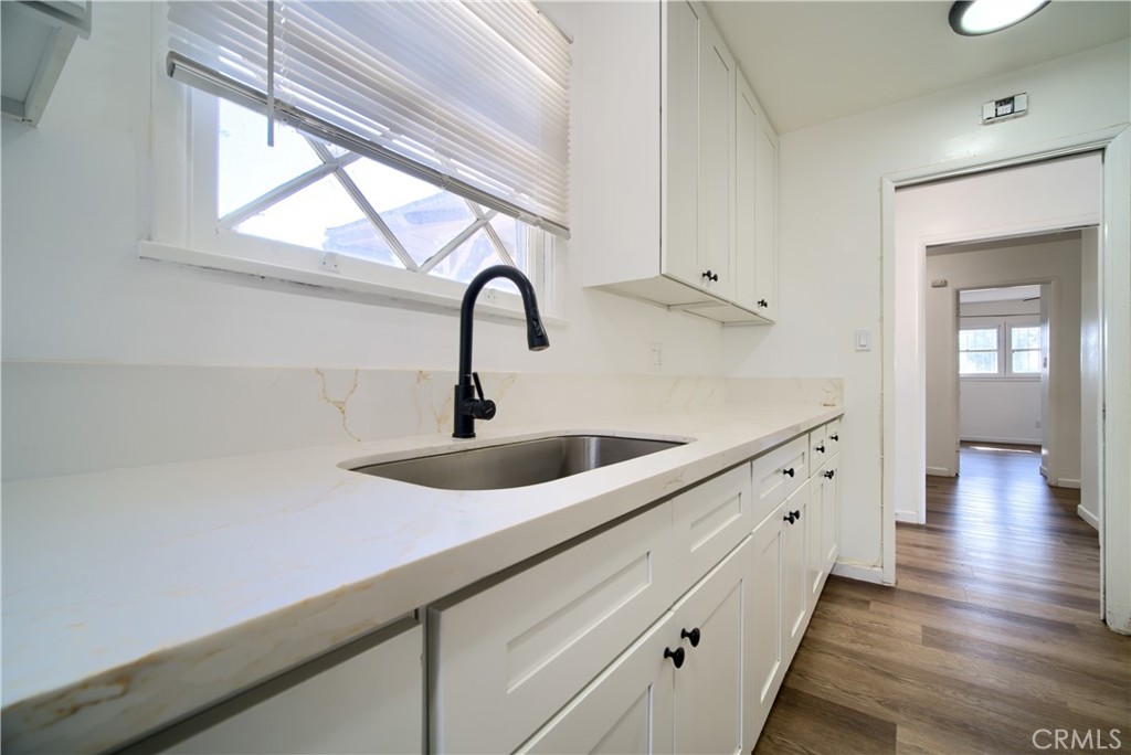6083 Merito Avenue San Bernardino, CA 92404 - Photo 6 of 17 a kitchen with sink and window
