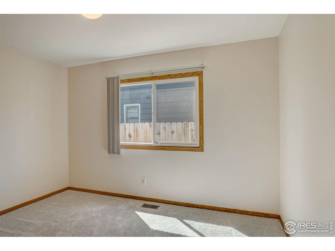 3317 Laredo Lane Fort Collins, CO 80526 - Photo 15 of 33 a view of an empty room with a window