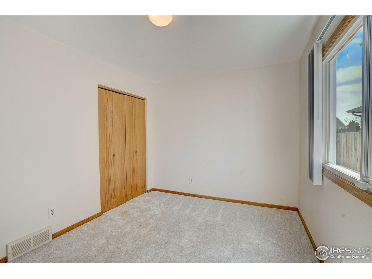 3317 Laredo Lane Fort Collins, CO 80526 - Photo 16 of 33 a view of an empty room and window