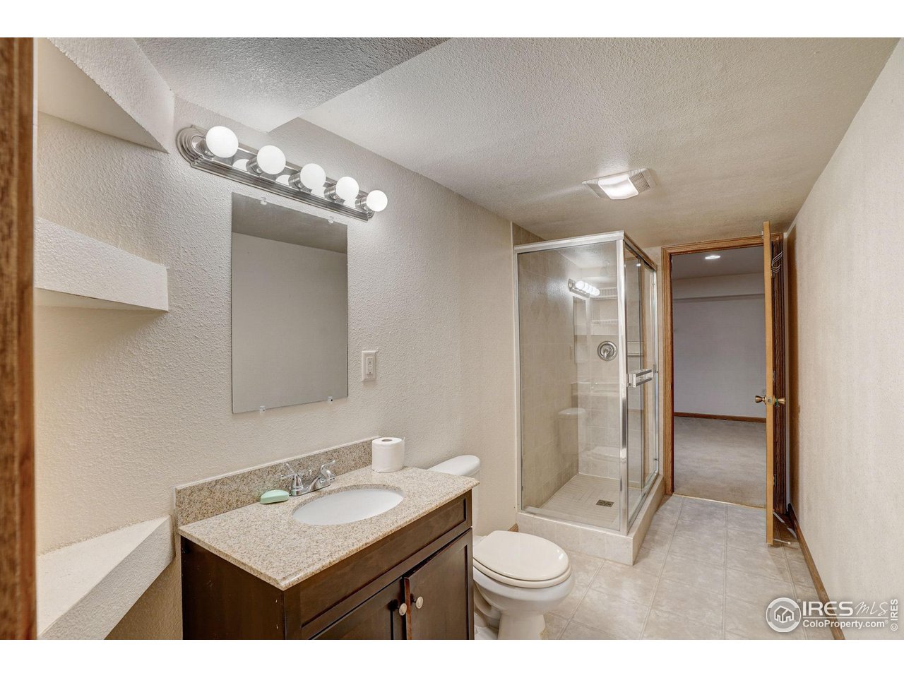 3317 Laredo Lane Fort Collins, CO 80526 - Photo 18 of 33 a bathroom with a sink double vanity and a mirror