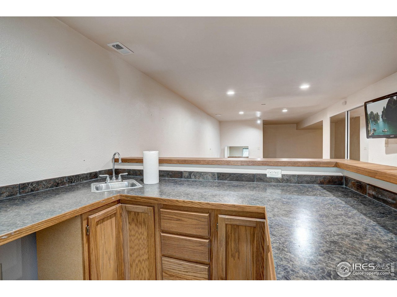 3317 Laredo Lane Fort Collins, CO 80526 - Photo 10 of 33 a kitchen with a sink and cabinets