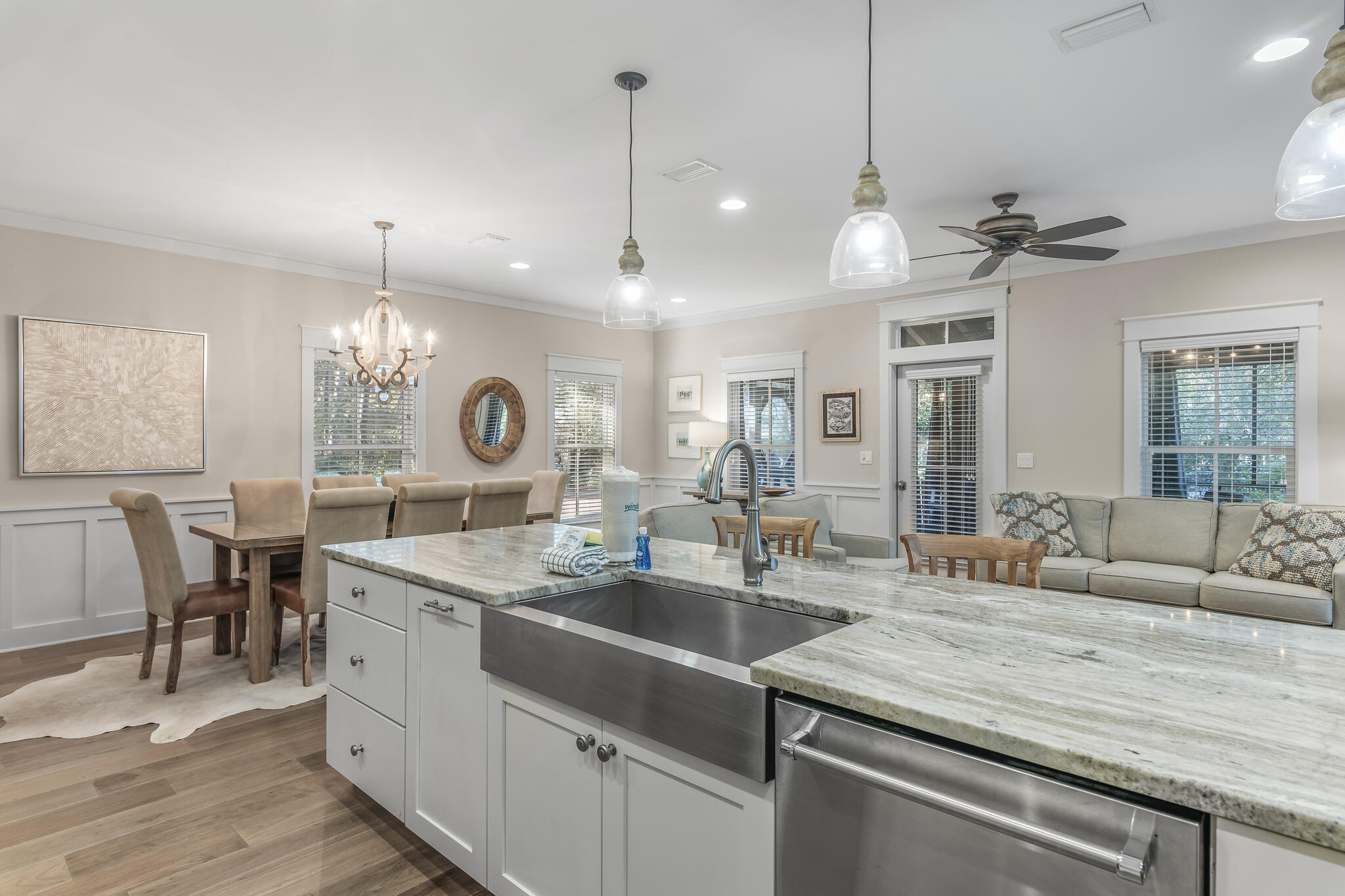 973 Patina Blvd Inlet Beach Inlet Beach, FL 32461 - Photo 13 of 30 a kitchen with center island a sink dishwasher a dining table and chairs with wooden floor