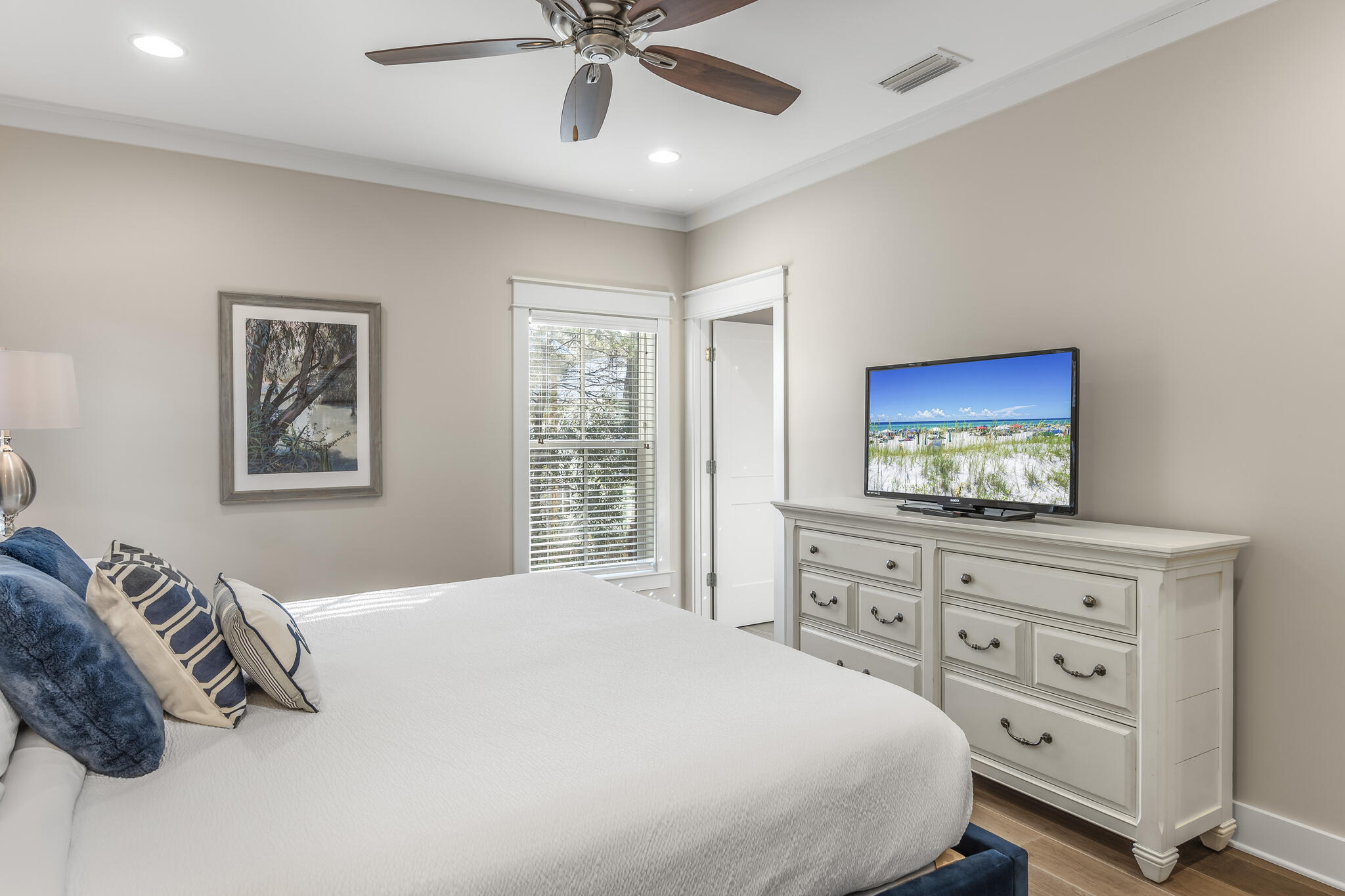 973 Patina Blvd Inlet Beach Inlet Beach, FL 32461 - Photo 22 of 30 a bedroom with a bed and a flat screen tv