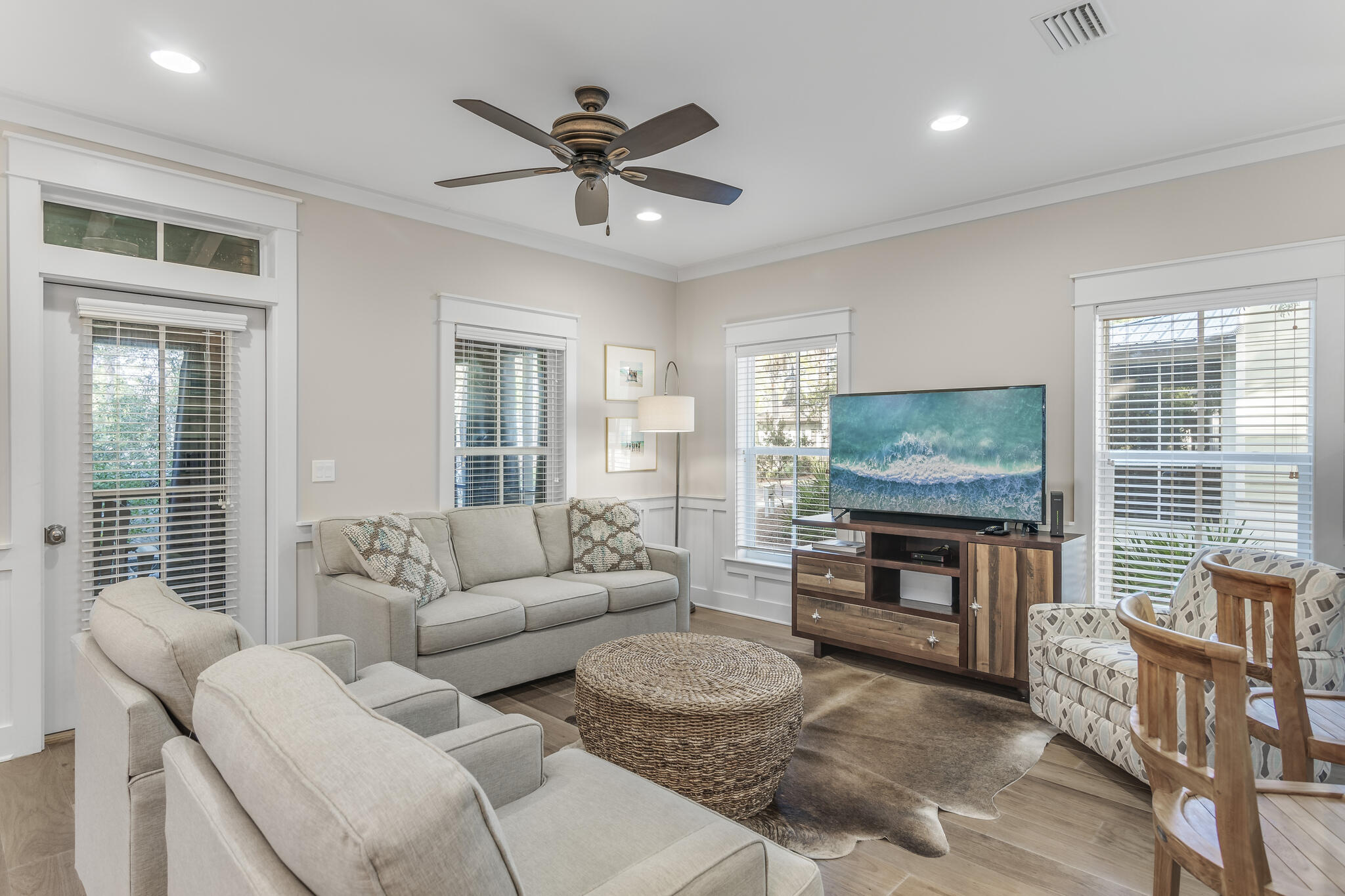 973 Patina Blvd Inlet Beach Inlet Beach, FL 32461 - Photo 6 of 30 a living room with furniture a flat screen tv and a fireplace
