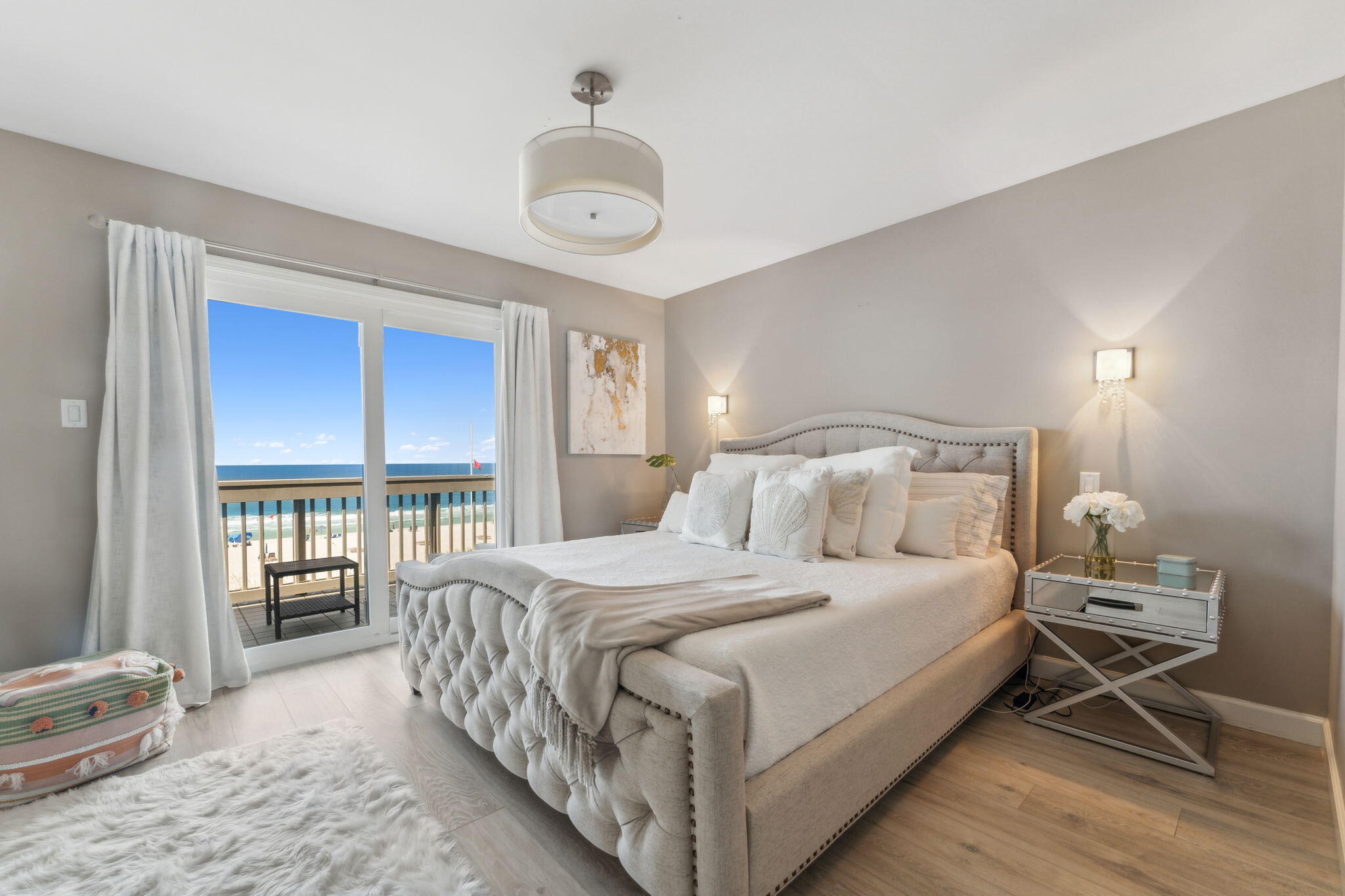 23011 Front Beach Road, Unit E47 Panama City Beach, FL 32413 - Photo 15 of 29 a bedroom with a bed and a large window