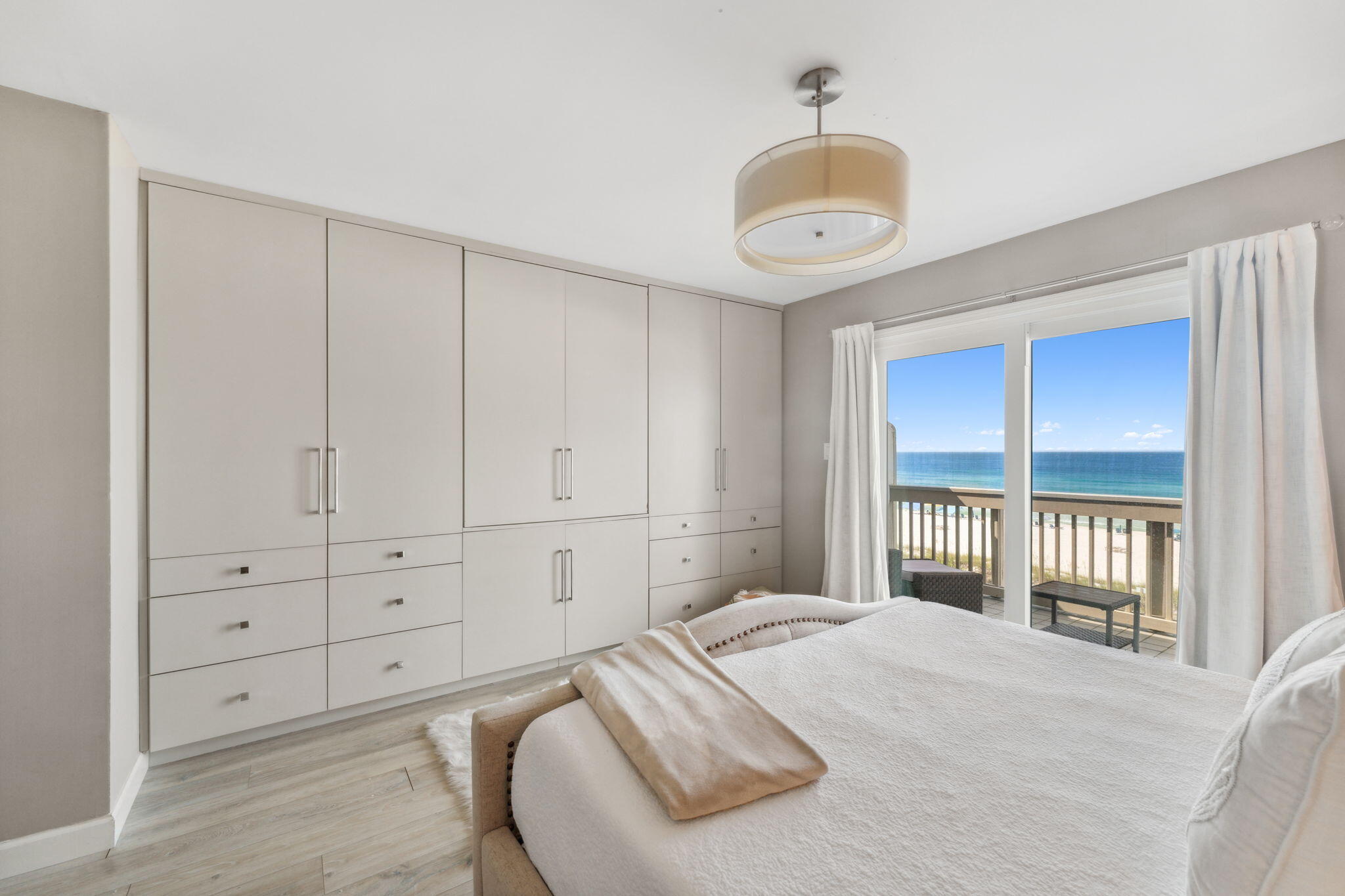23011 Front Beach Road, Unit E47 Panama City Beach, FL 32413 - Photo 16 of 29 a bedroom with a large bed and a window