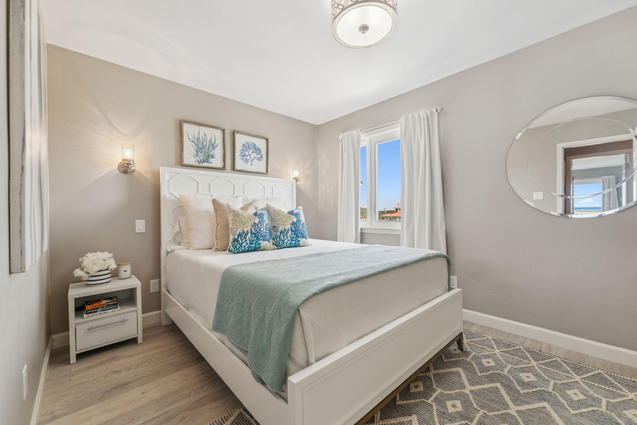 23011 Front Beach Road, Unit E47 Panama City Beach, FL 32413 - Photo 23 of 29 a bedroom with a bed and a lamp