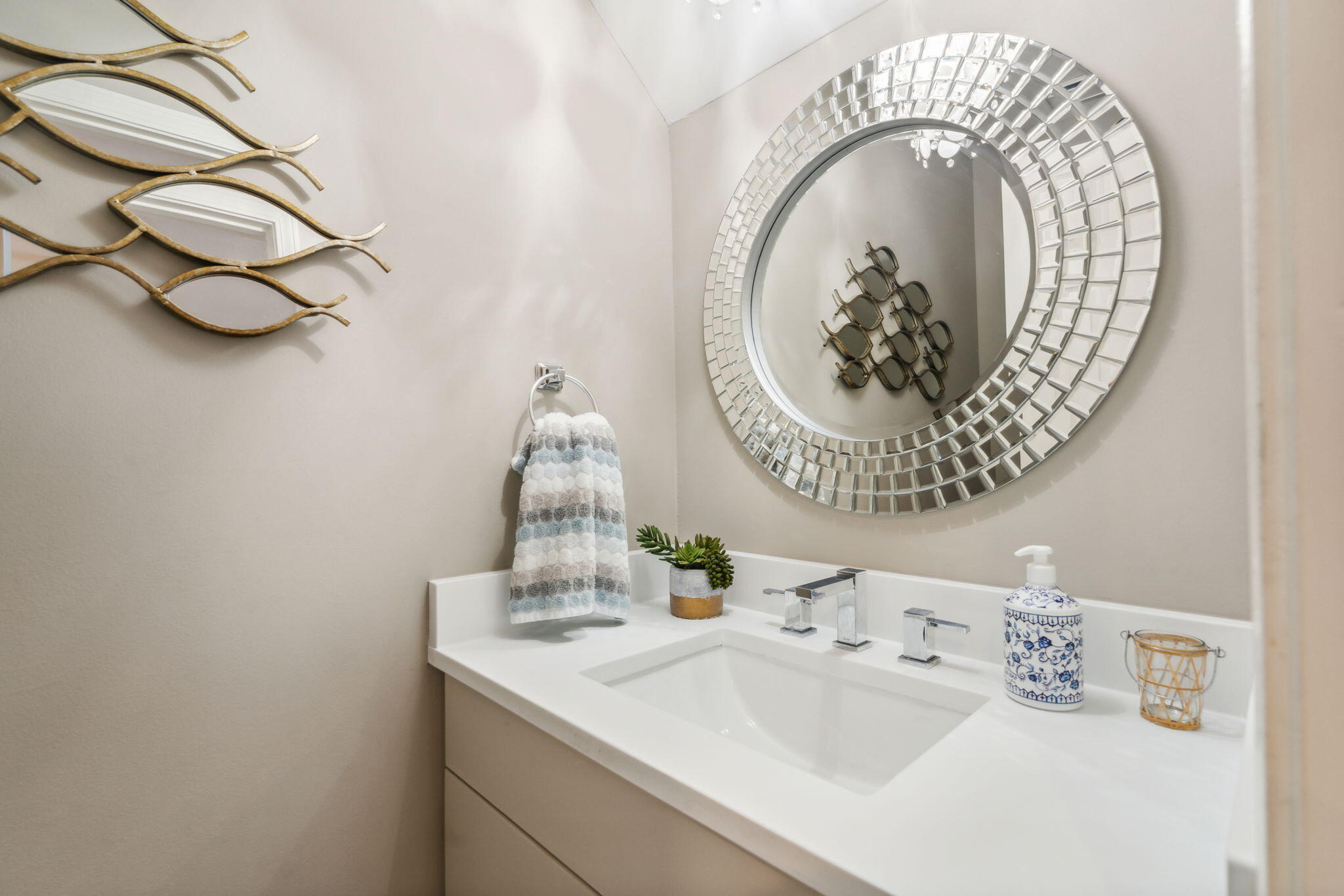 23011 Front Beach Road, Unit E47 Panama City Beach, FL 32413 - Photo 26 of 29 a bathroom with a sink and a mirror