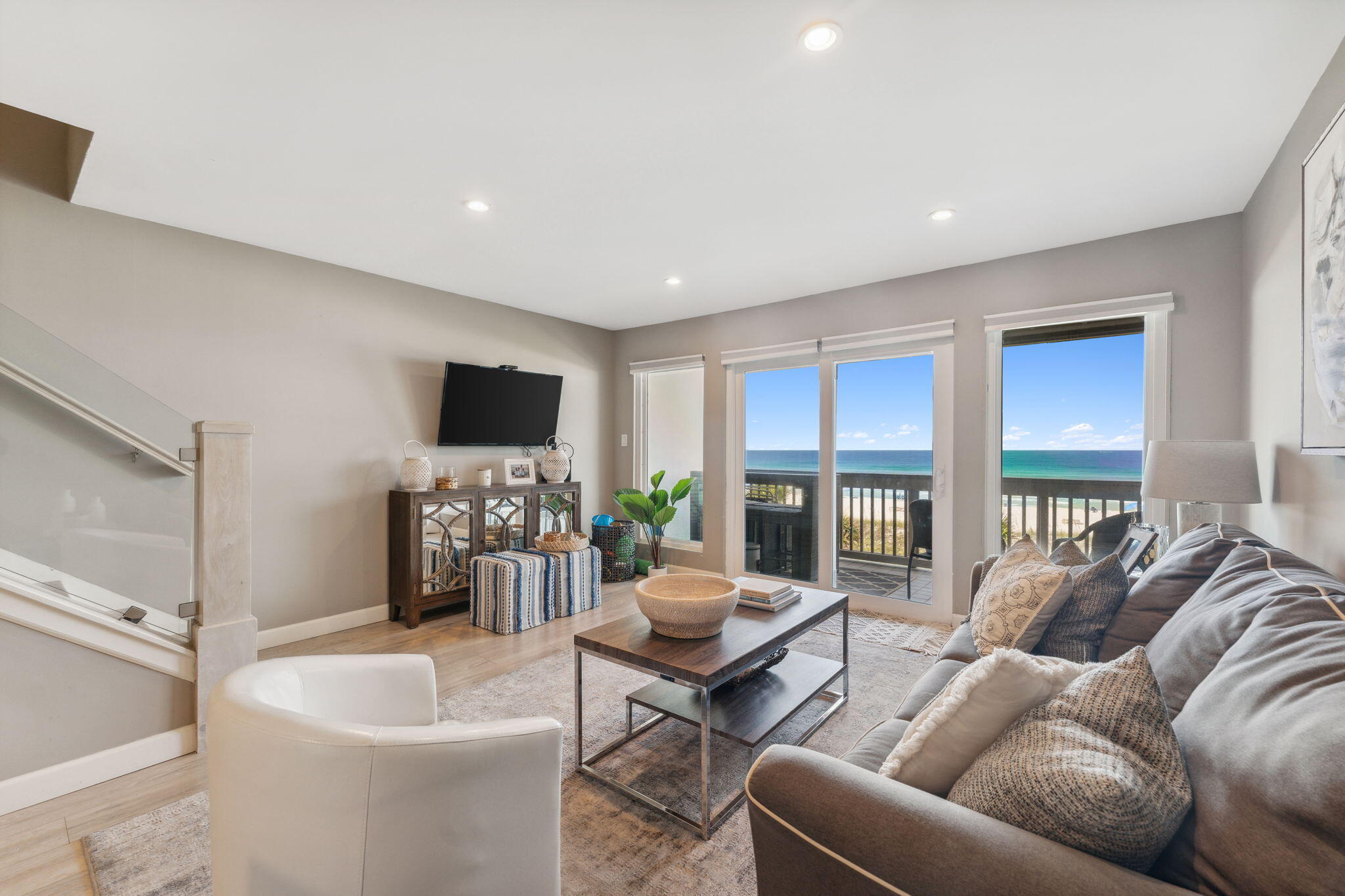 23011 Front Beach Road, Unit E47 Panama City Beach, FL 32413 - Photo 6 of 29 a living room with furniture and a flat screen tv