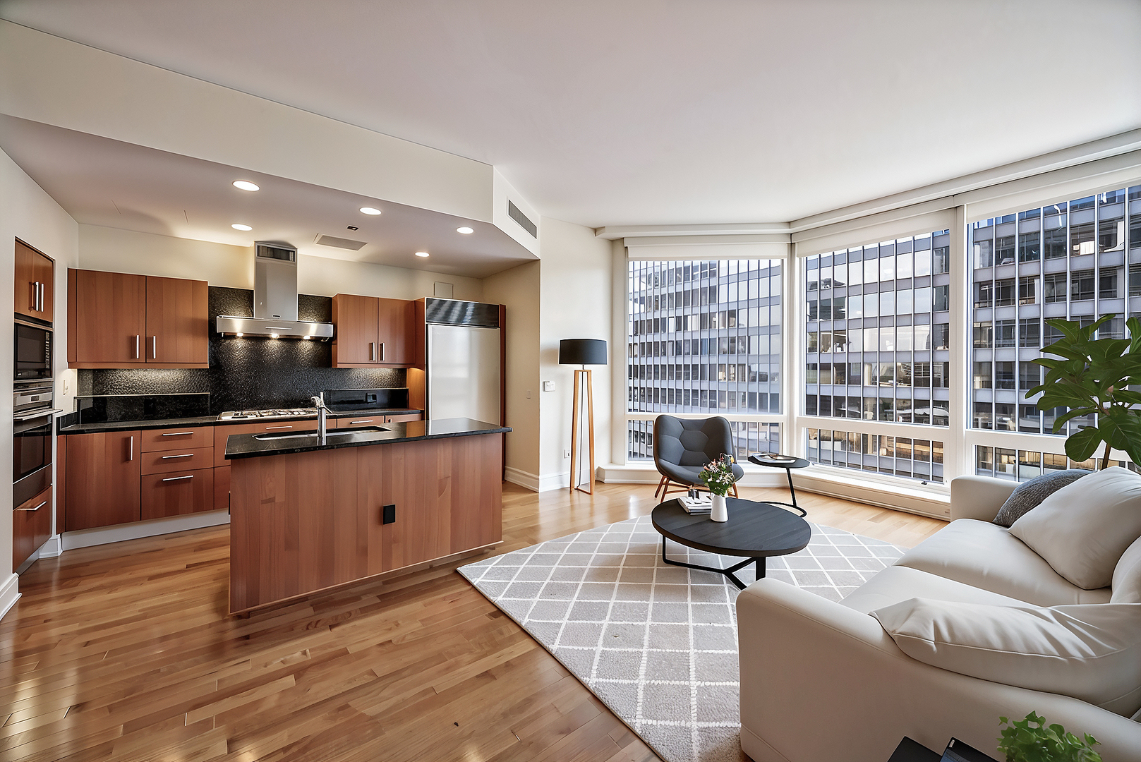 401 North Wabash Avenue, Unit 31G Chicago, IL 60611 - Photo 2 of 46 a kitchen with stainless steel appliances kitchen island granite countertop a table chairs in it and wooden floors