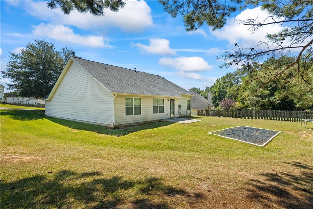 6639 Overlook Ridge Atlanta, GA 30349 - Photo 29 of 35 a view of a house with swimming pool and yard