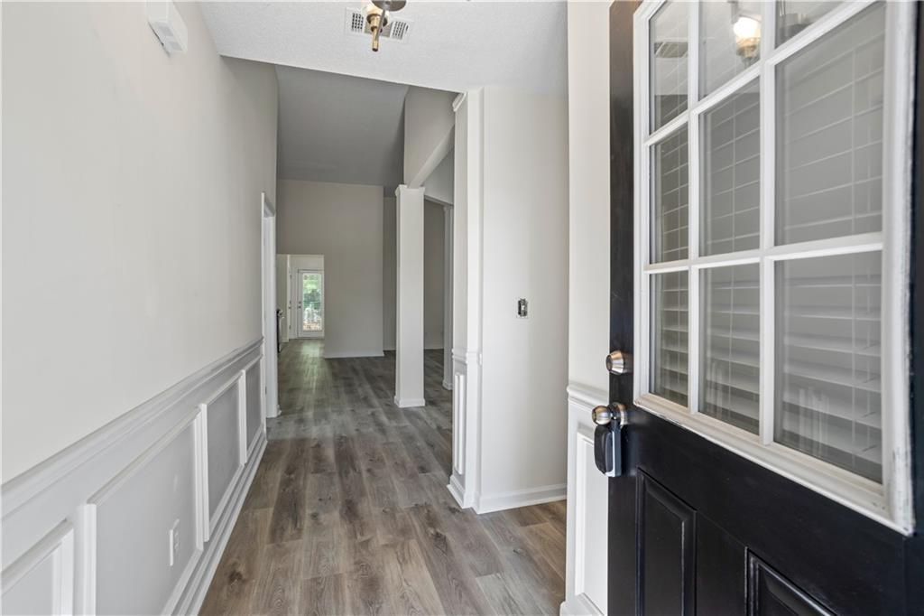6639 Overlook Ridge Atlanta, GA 30349 - Photo 3 of 35 a view of a hallway with wooden floor and a window