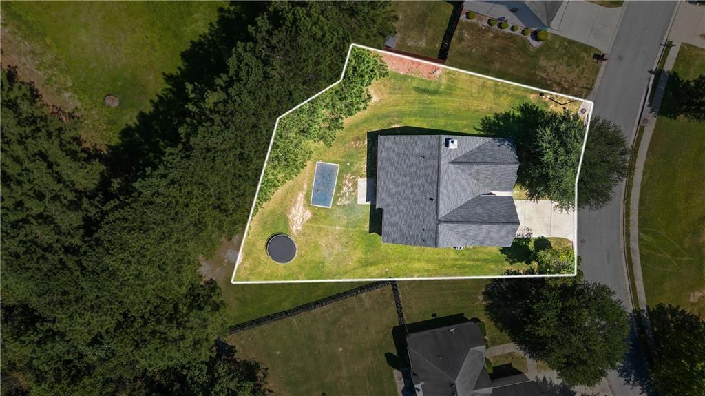 6639 Overlook Ridge Atlanta, GA 30349 - Photo 33 of 35 an aerial view of a house with a yard