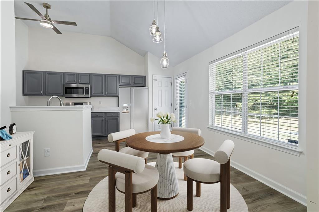 6639 Overlook Ridge Atlanta, GA 30349 - Photo 8 of 35 a view of a dining room with furniture and a chandelier