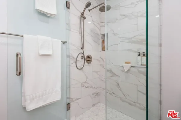 a bathroom with a sink a mirror and cabinets