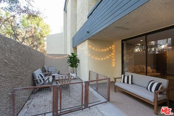 a outdoor living space with furniture and a potted plant
