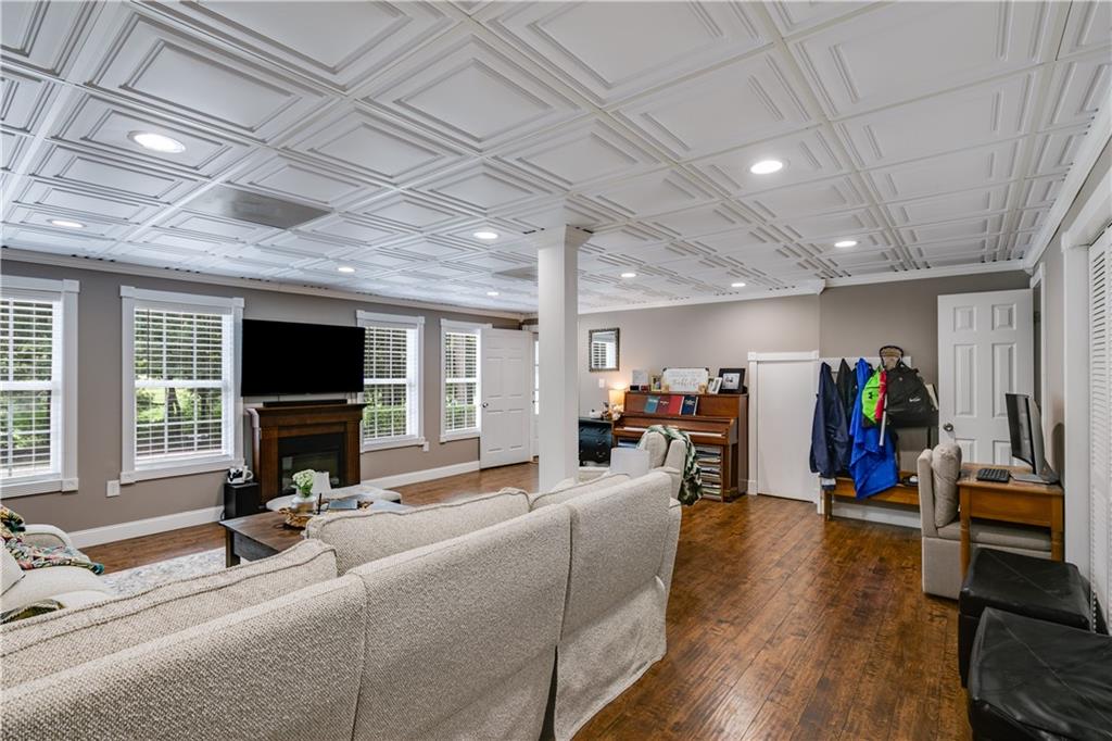 1800 Mandeville Road Bremen, GA 30110 - Photo 16 of 41 a view of a livingroom with furniture a flat screen tv and windows