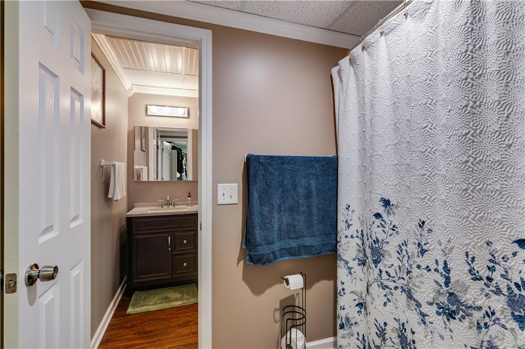 1800 Mandeville Road Bremen, GA 30110 - Photo 19 of 41 a bathroom with a granite countertop sink a toilet and shower