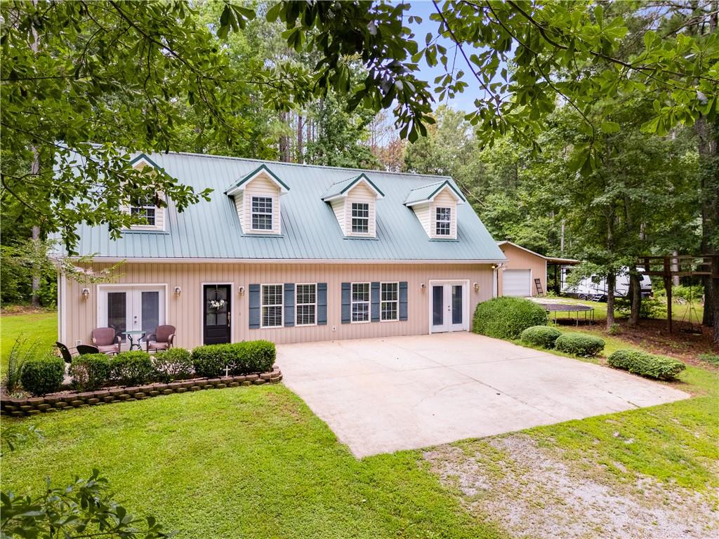 1800 Mandeville Road Bremen, GA 30110 - Photo 2 of 41 a front view of a house with a yard and trees