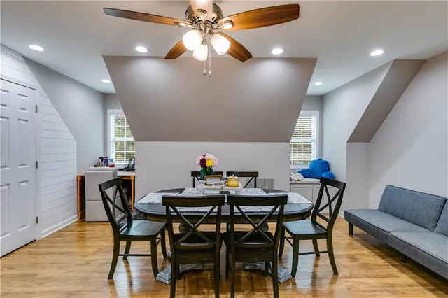 a view of a dining room with furniture and wooden floor