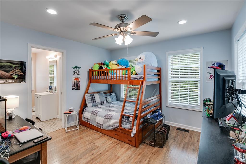 1800 Mandeville Road Bremen, GA 30110 - Photo 27 of 41 a bedroom with bed and a chandelier