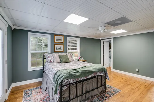 a bedroom with a large bed and a window