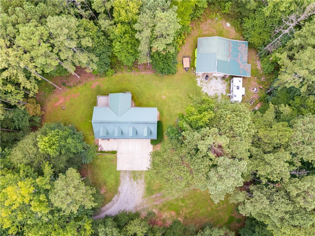 1800 Mandeville Road Bremen, GA 30110 - Photo 3 of 41 an aerial view of a house with a yard lake and trees all around