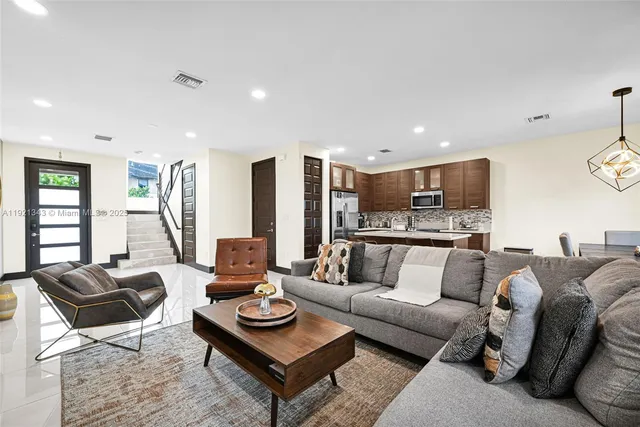 a bathroom with a sink toilet vanity and shower