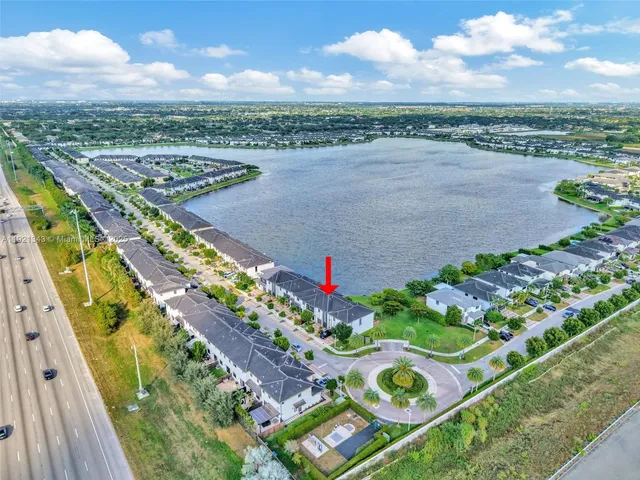 a view of yard with swimming pool and furniture
