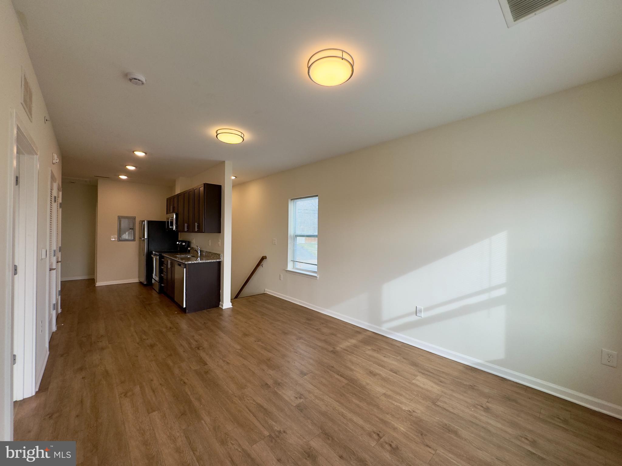 4909 Hamilton Avenue, Unit 4909B Baltimore, MD 21206 - Photo 2 of 15 a view of kitchen and a sink with wooden floor