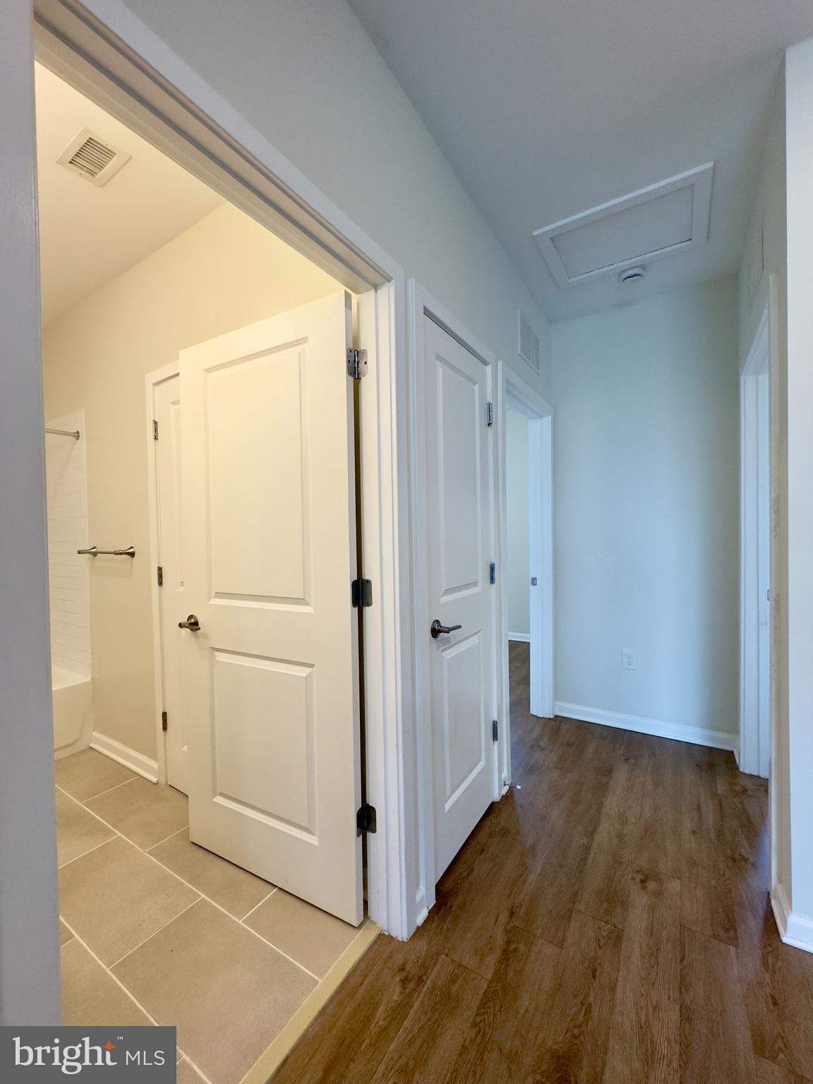 4909 Hamilton Avenue, Unit 4909B Baltimore, MD 21206 - Photo 10 of 15 a view of a hallway with wooden floor and cabinet