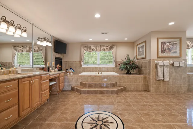 a bathroom with a glass shower door and a sink