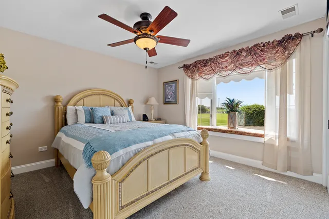 a bathroom with a granite countertop sink a large mirror and a shower