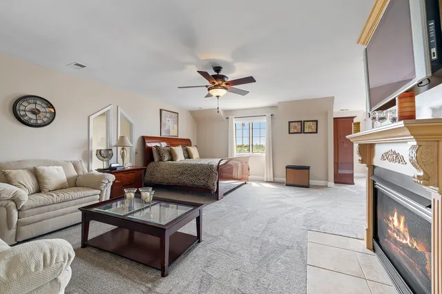 a large en suite bathroom with a tub sink and mirror