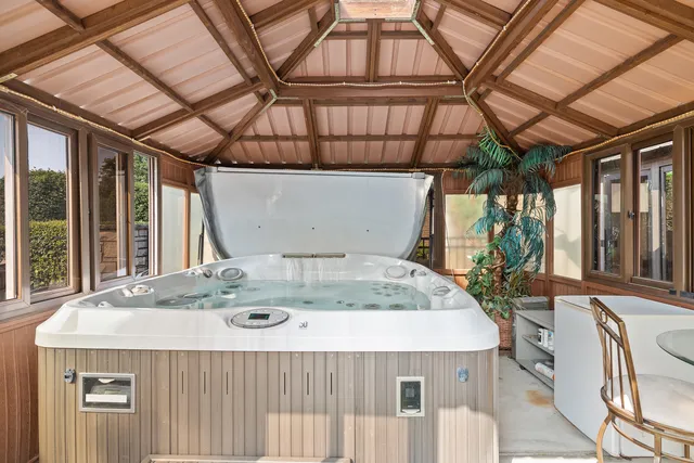 an aerial view of a house with a ocean view