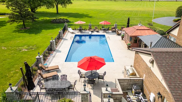 a view of balcony with wooden floor and seating space