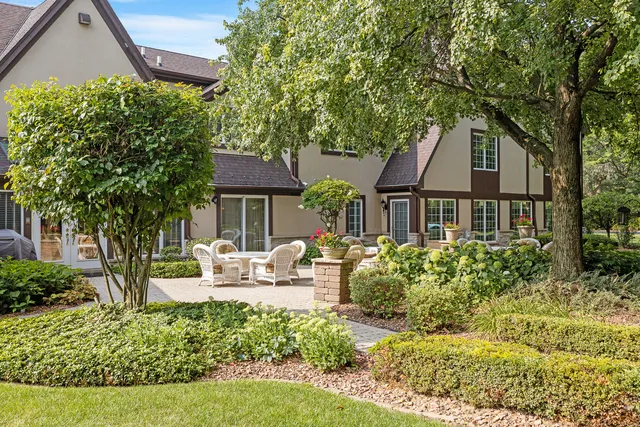 a backyard of a house with fire pit barbeque oven and outdoor view