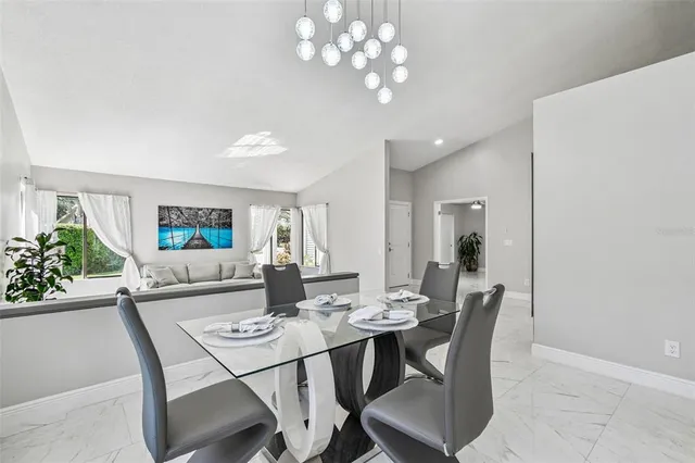 a view of a dining room with furniture window and outside view